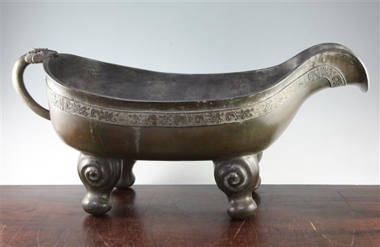 A large Chinese bronze pouring vessel, Yi, 17th / 18th century, length 74.5cm